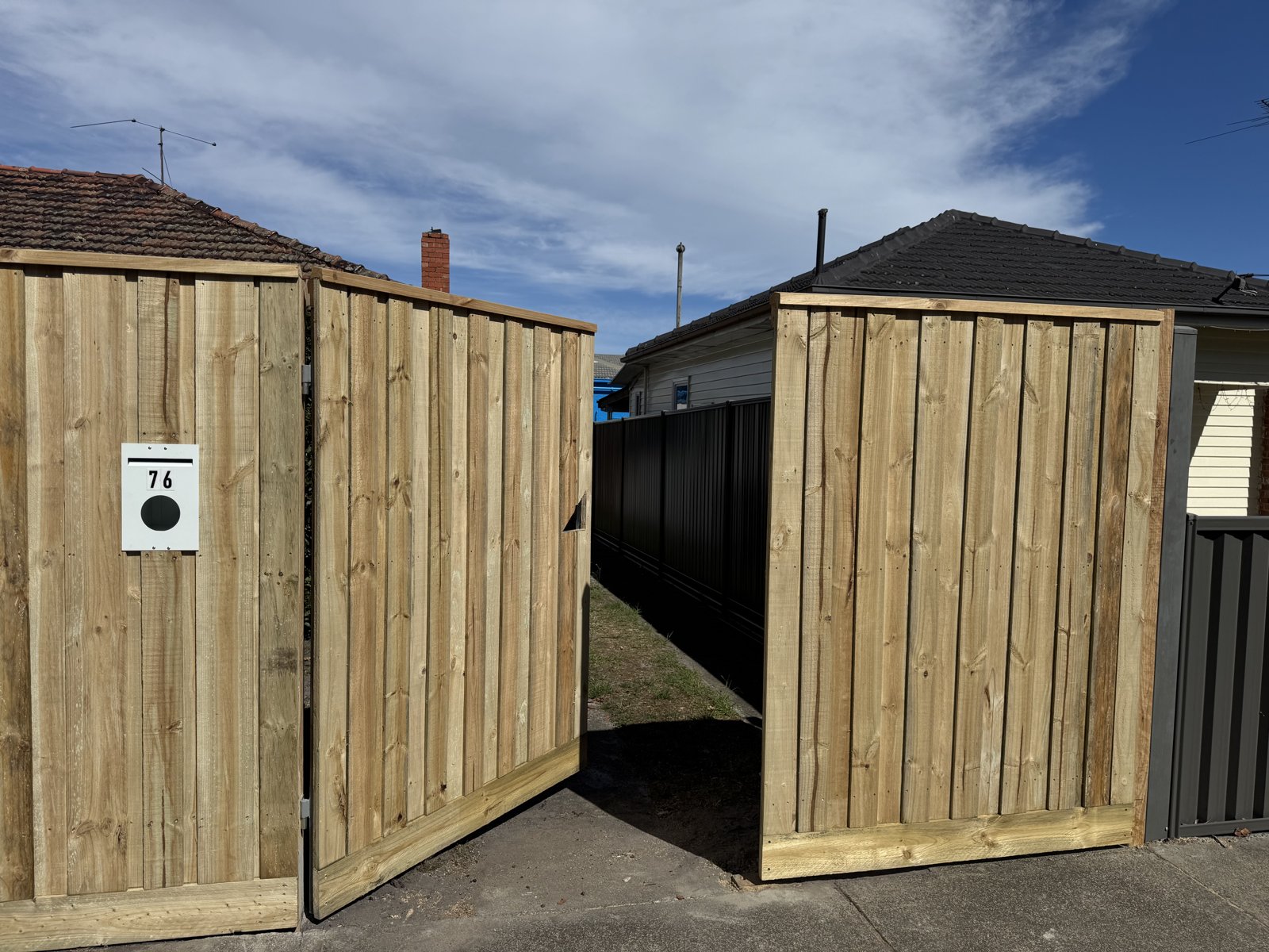 Timber gate and paling fence